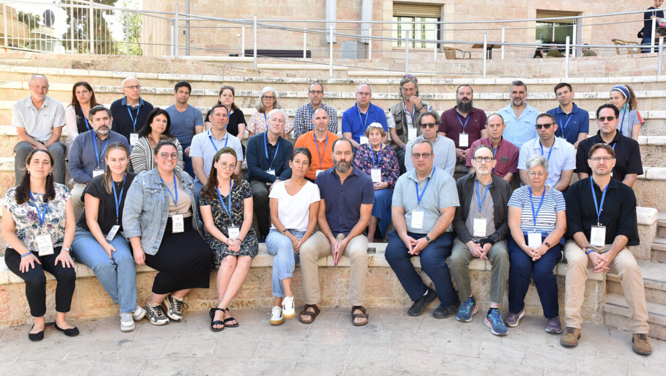 Conservative rabbis from across the United States surround Rachel Goldberg and Jon Polin, whose son Hersh Goldberg-Polin was taken hostage on Oct. 7, 2023, at the Fuchsberg Jerusalem Center, Oct 31, 2023. (Courtesy Fuchsberg Center)