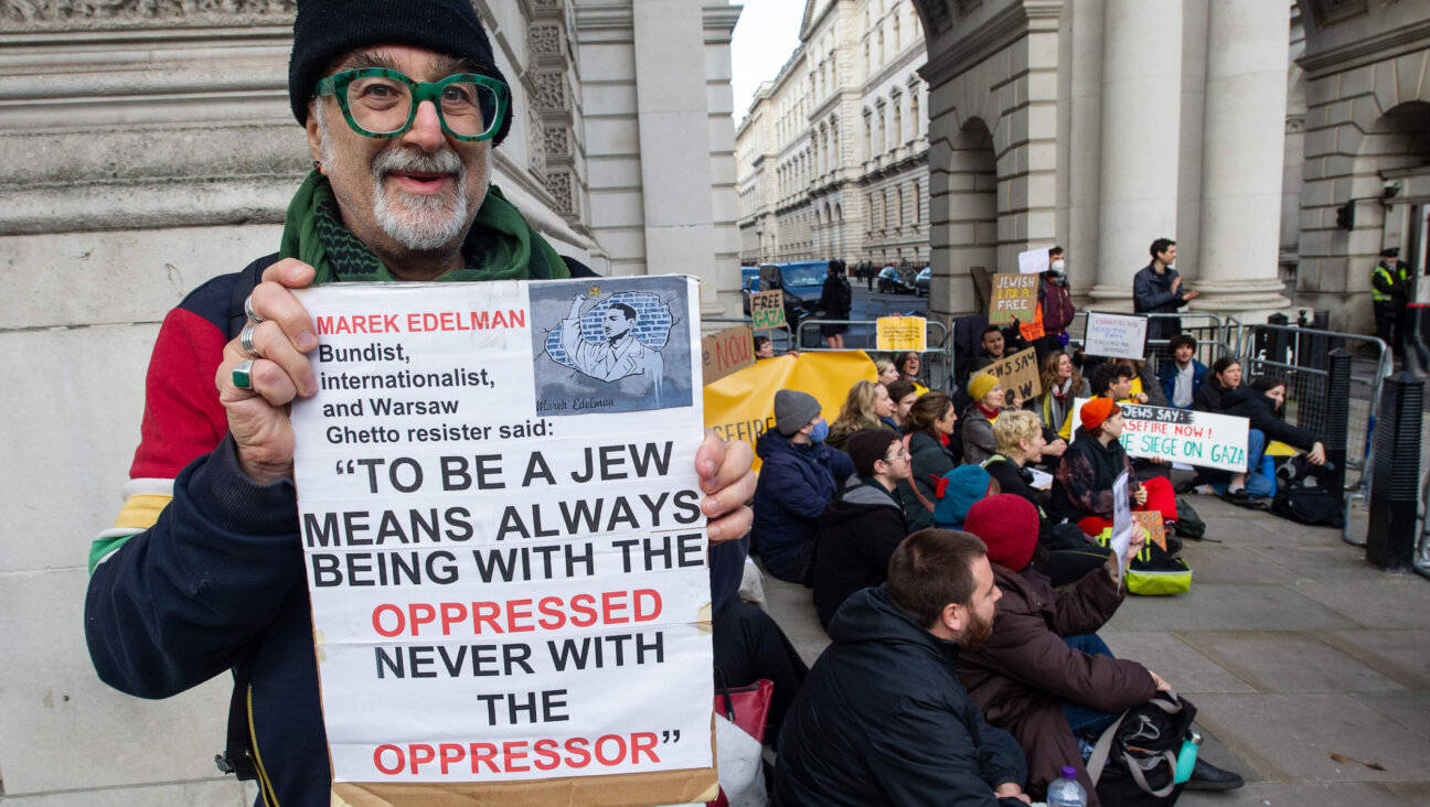 Activists from Na'amod, an organization of British Jews who oppose Israel's occupation of the West Bank, blocked walkways into a government building last week to demand a cease-fire in Gaza.