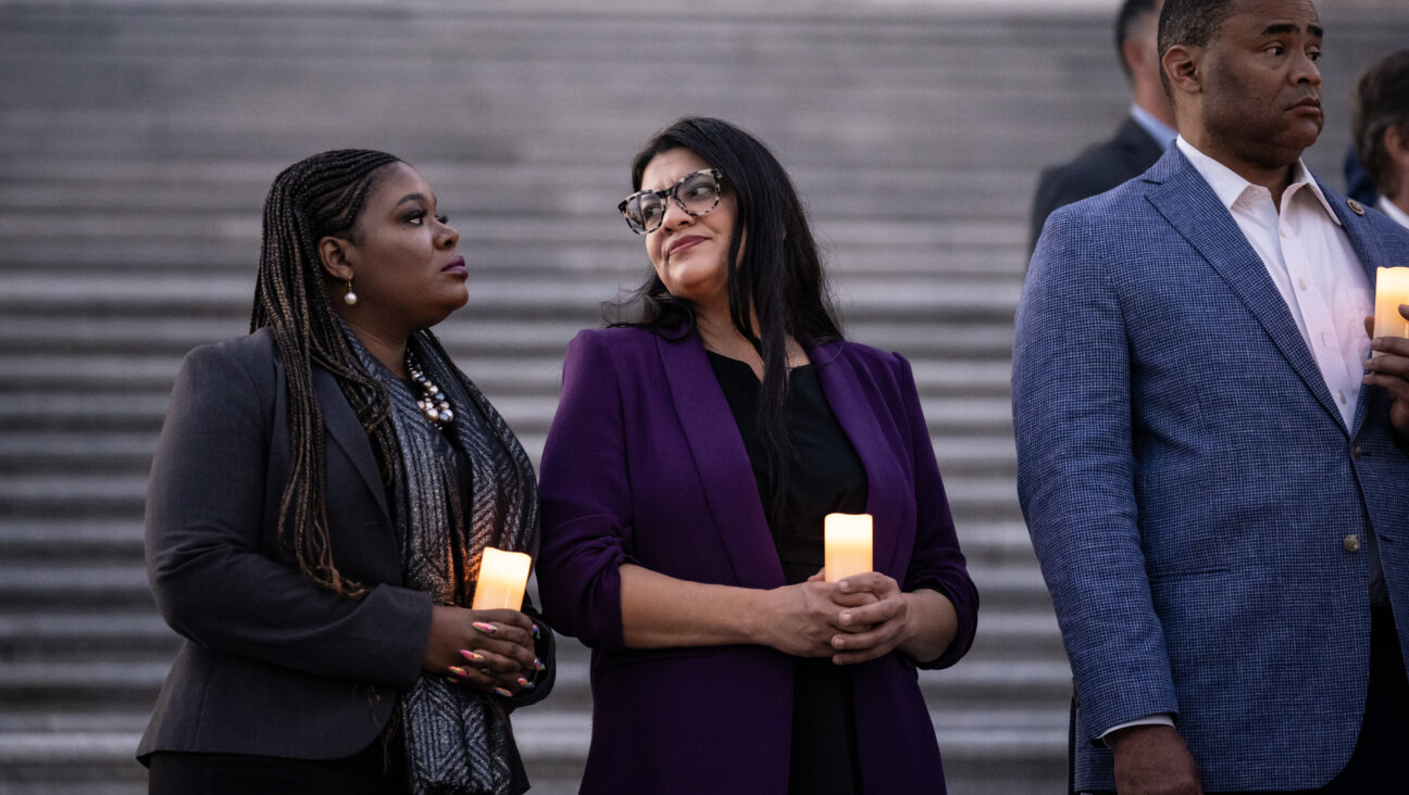 Rep. Rashida Tlaib (D-Mich.) attends a bipartisan candlelight vigil to commemorate one month since the Oct. 7 Hamas attack.