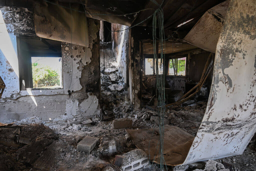 A destroyed house is seen in the aftermath of Hamas' Oct. 7 attacks on a kibbutz near the Gaza border. Questions are being raised about images freelance photographers took of the attacks as they unfolded. 