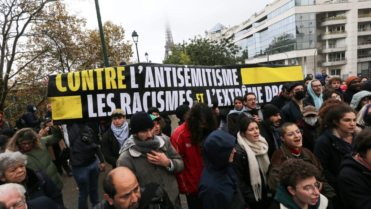 Demonstrators carry a banner reading “Against antisemitism, racism and the extreme right” during a rally at the Square des Martyrs Juifs in Paris, Nov. 12, 2023. (Michel Stoupak/NurPhoto via Getty Images)
