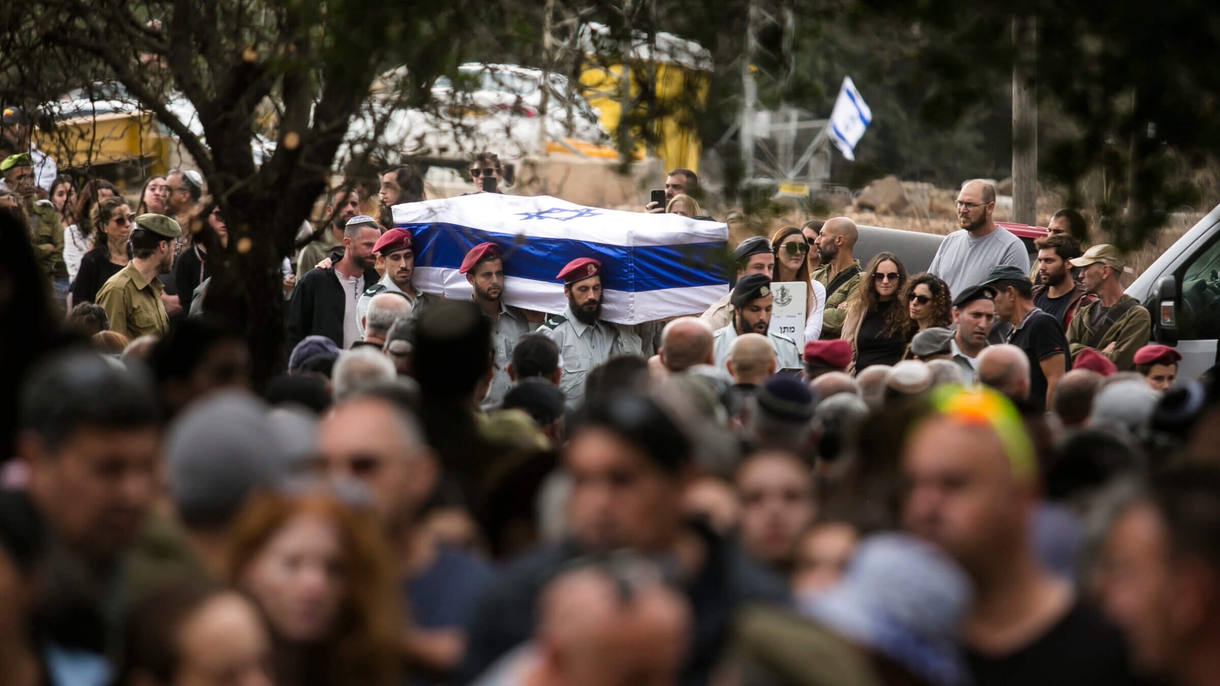 Family and friends mourn during the funeral of fallen soldier Matan Meir, killed in the Gaza Strip, on Nov. 13 in Odem, Israel. The Jewish way of grieving individual loss can be instructive now as the global Jewish community copes with the staggering losses over the past month.