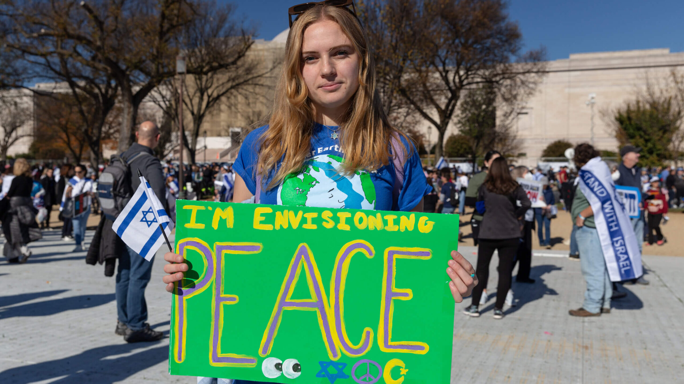 Sabrina Rubenstein, a recent Tulane University graduate, holds a sign at the March for Israel in Washington, D.C. on Nov. 14.