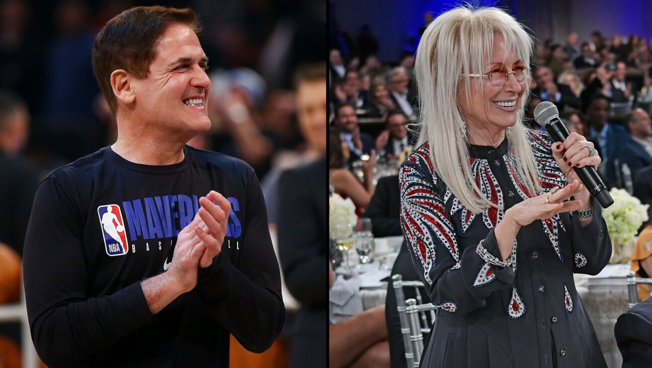 Mark Cuban, left, is selling a significant stake in the NBA’s Dallas Mavericks to Miriam Adelson, right. (Getty Images)