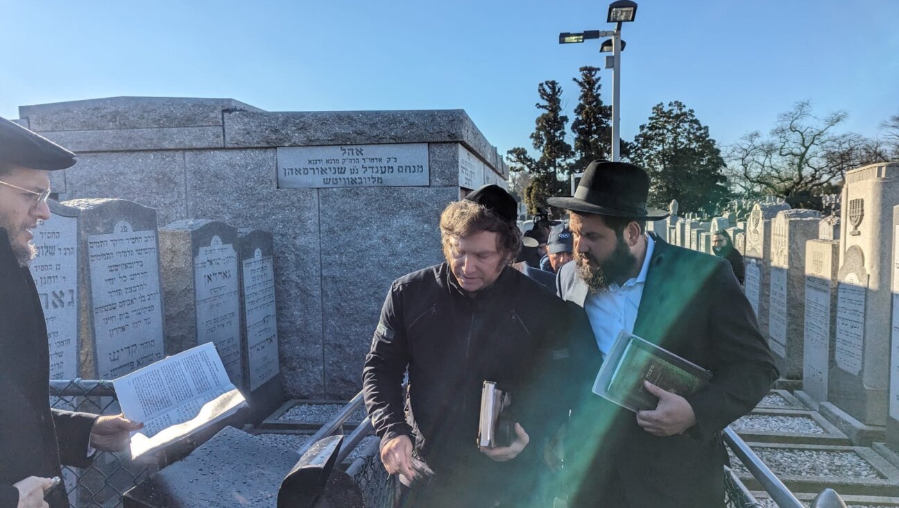 Javier Milei, who was elected president of Argentina in November 2023, visits the grave of the Lubavitcher rabbi in Queens, New York, Nov. 27, 2023. (Courtesy Chabad)