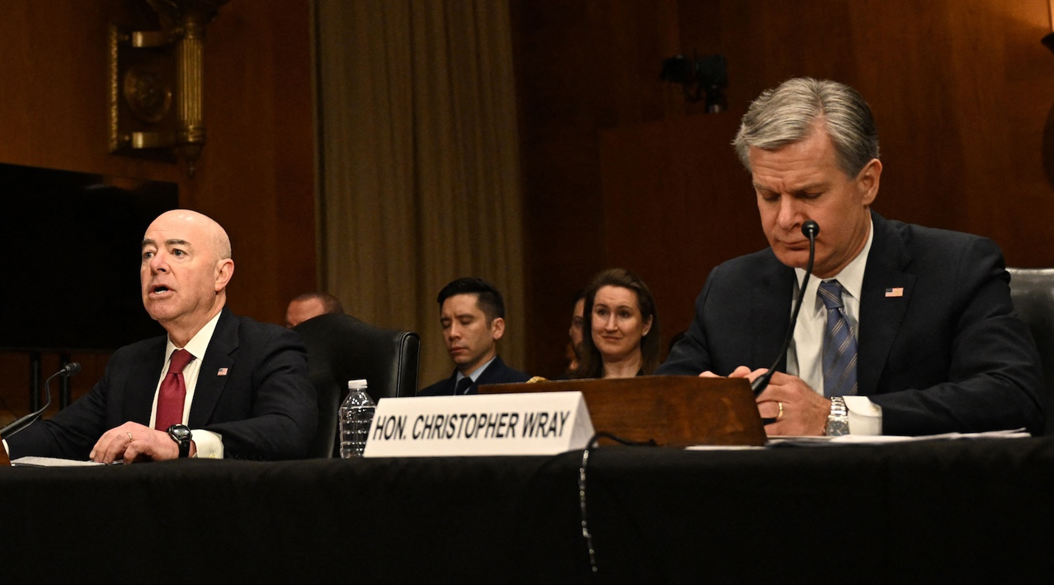 FBI Director Christopher Wray looks on as U.S. Homeland Security Secretary Alejandro Mayorkas testifies during a Senate Homeland Security and Government Affairs Committee hearing on Capitol Hill, Oct. 31, 2023. (MANDEL NGAN/AFP via Getty Images)