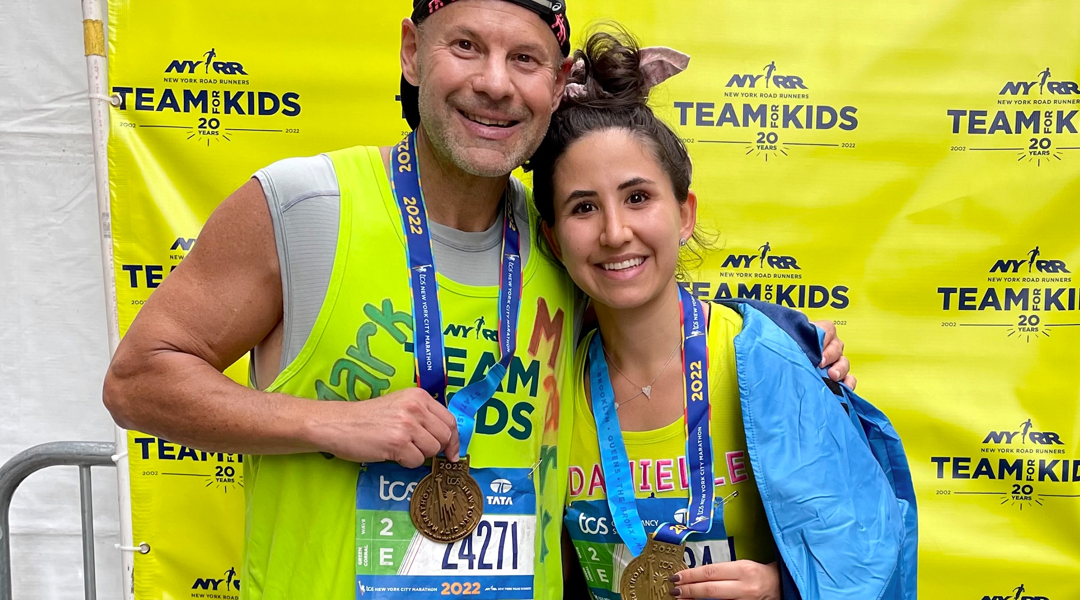 Mark Shapiro and his daughter after completing the 2022 New York City Marathon. This year, Shapiro will run wearing a T-shirt with the image of an Israeli child who was kidnapped by Hamas on Oct. 7. (Courtesy)