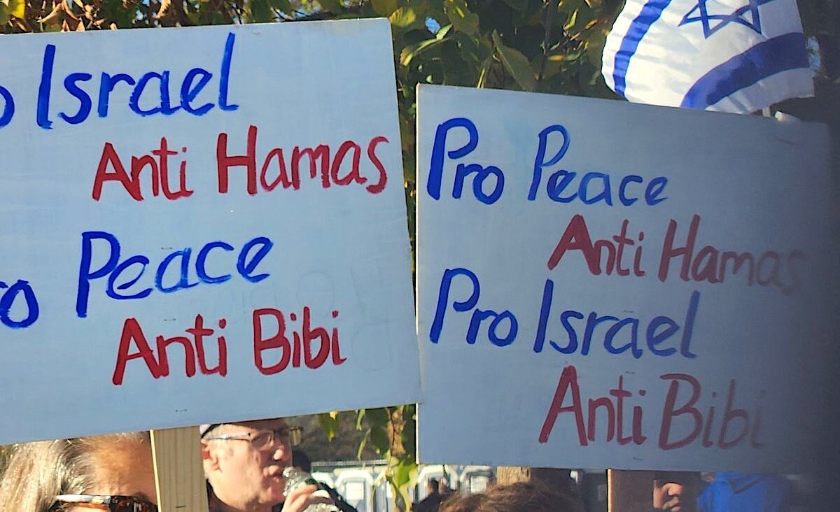 Signs held by members of the “peace bloc” who attended at the March for Israel in Washington, D.C., Nov. 14, 2023. (JTA)