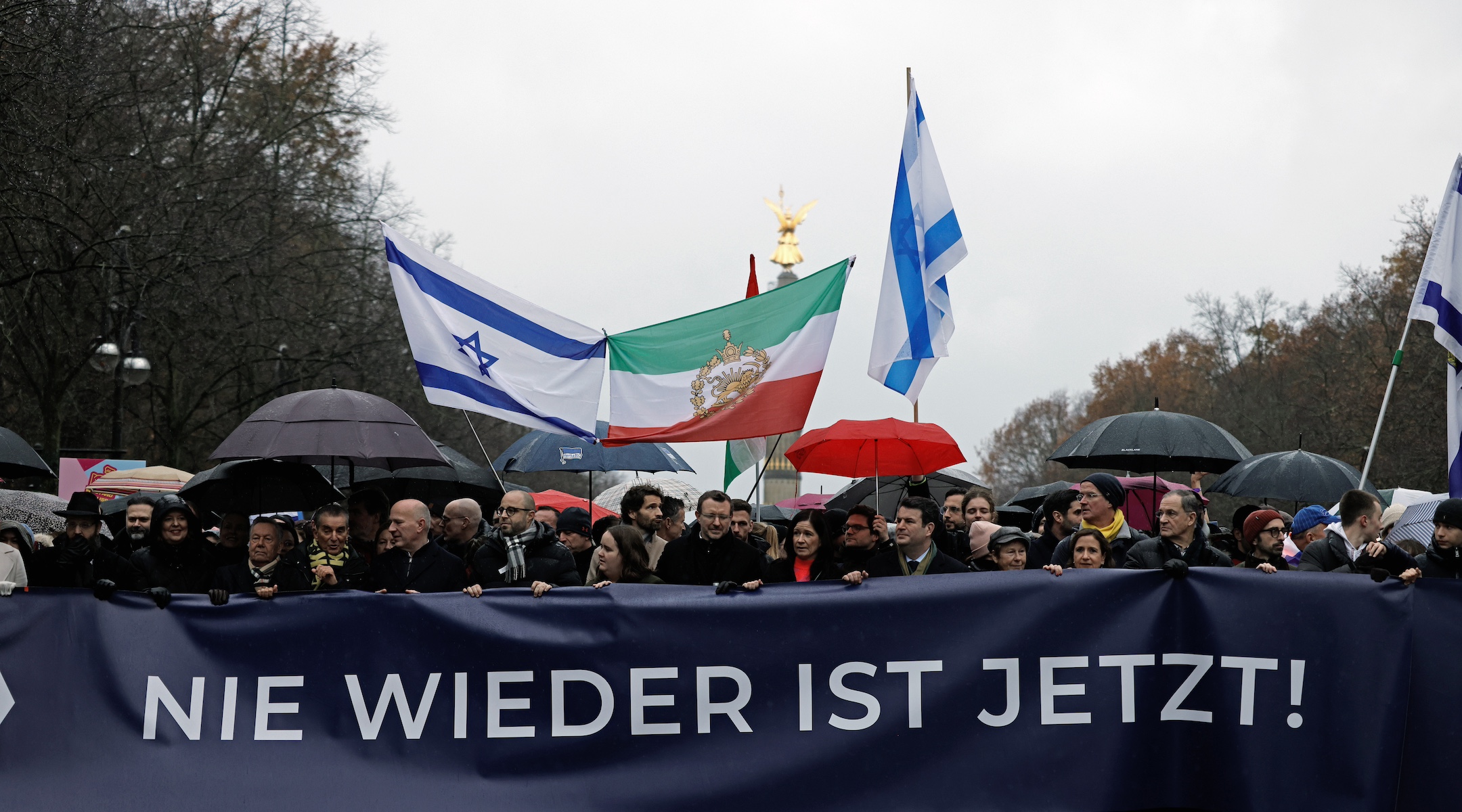 A banner reads “Never again is now!” at a pro-Israel rally in Berlin, Dec. 10, 2023. (Carsten Koall/picture alliance via Getty Images)
