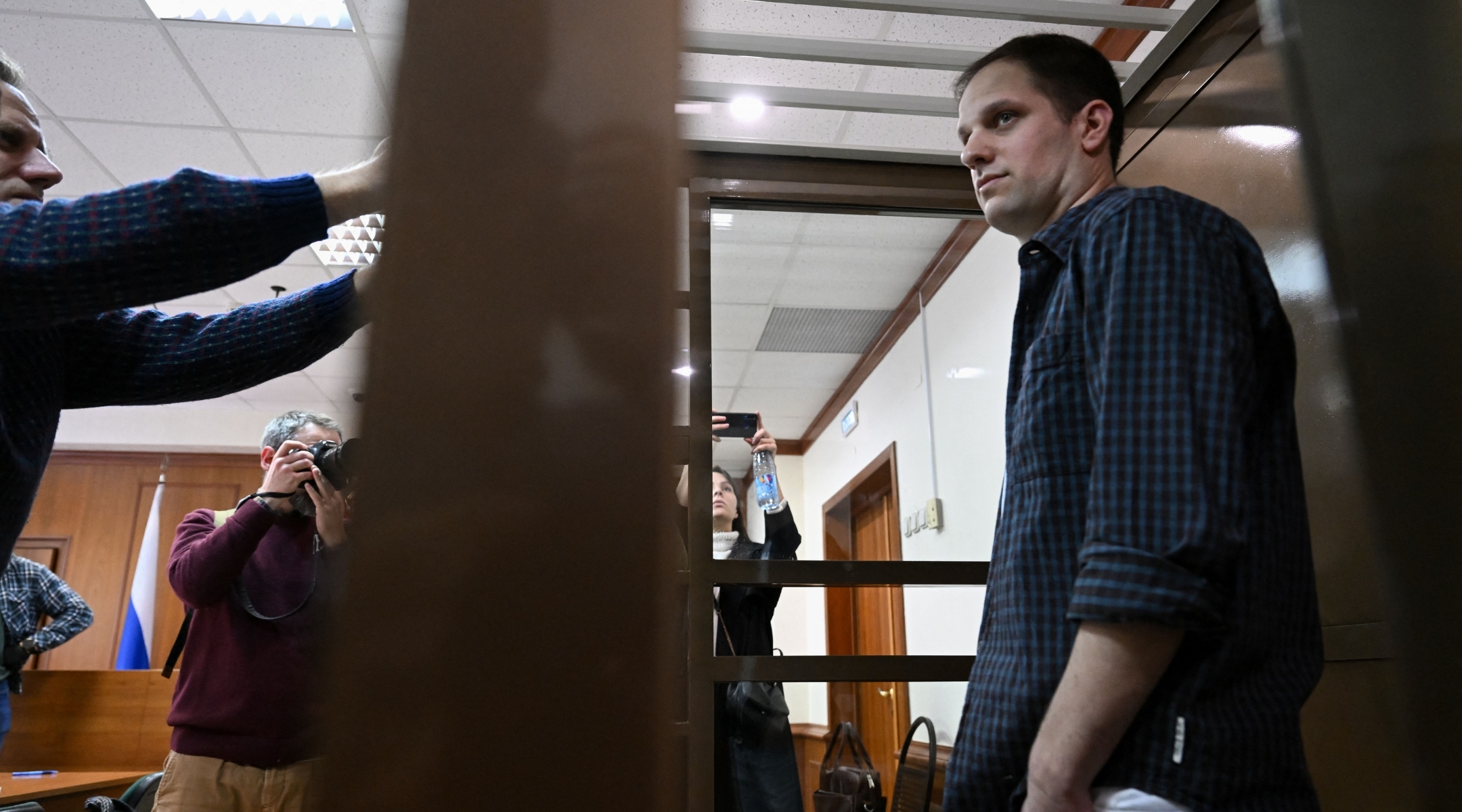Evan Gershkovich in a defendants’ cage before a hearing to consider an appeal on his extended pre-trial detention at the Moscow City Court on Oct. 10, 2023. (Natalia Kolesnikova/AFP via Getty Images)