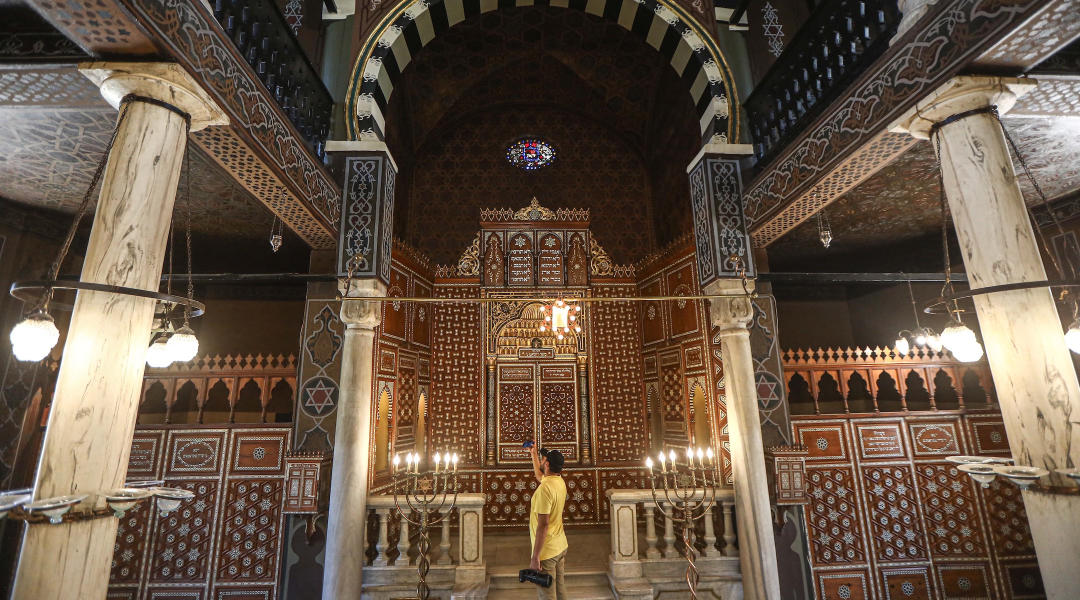 A man takes photos inside the Jewish Ben Ezra Synagogue after its restoration in Cairo, Sept. 1, 2023. (Ahmed Gomaa/Xinhua via Getty Images)