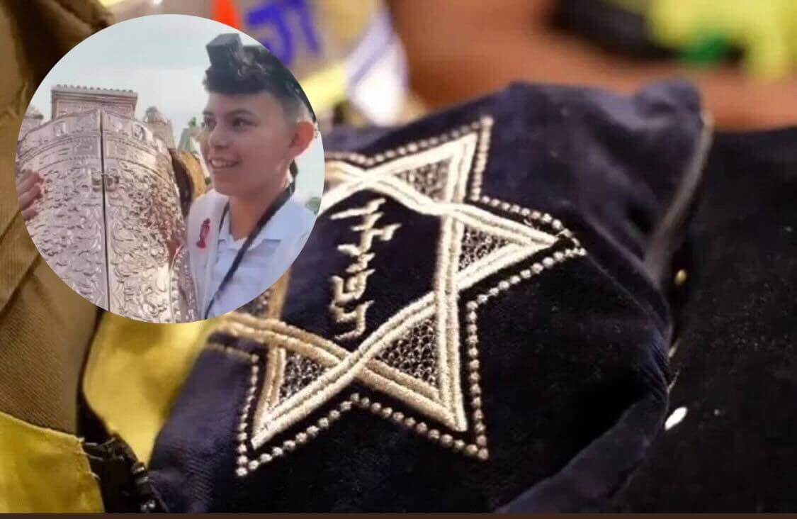 Ariel Zohar celebrating his bar mitzvah with a pair of tefillin that was passed on by his Holocaust surviving grandfather and rescued from wrekced home in Kibbutz Nahal Oz on Dec. 6.