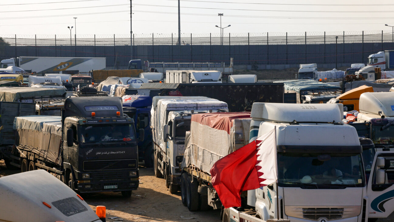 Humanitarian aid trucks lined up at the Egypt-run Rafah Crossing into Gaza after the truce expired Friday morning. (SAID KHATIB/AFP via Getty Images)