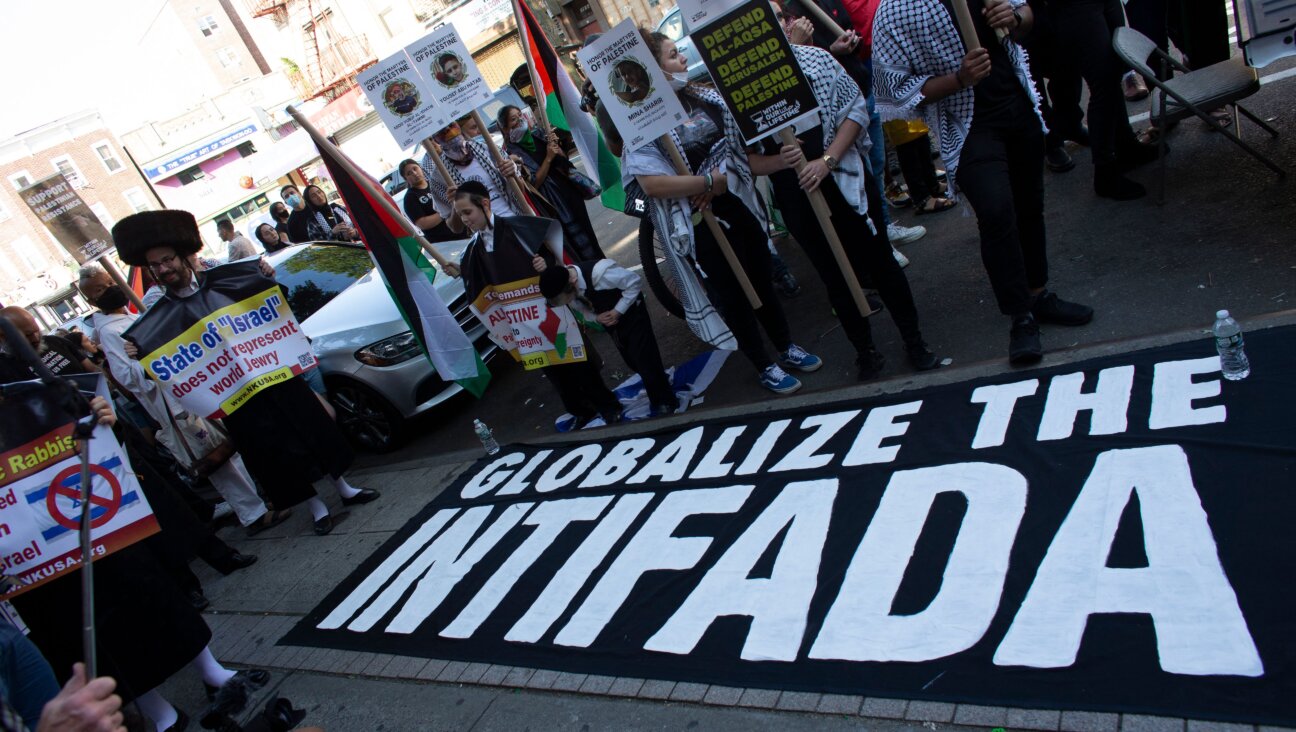 A sign reading "Globalize The Intifada" as people demonstrate in 2021.