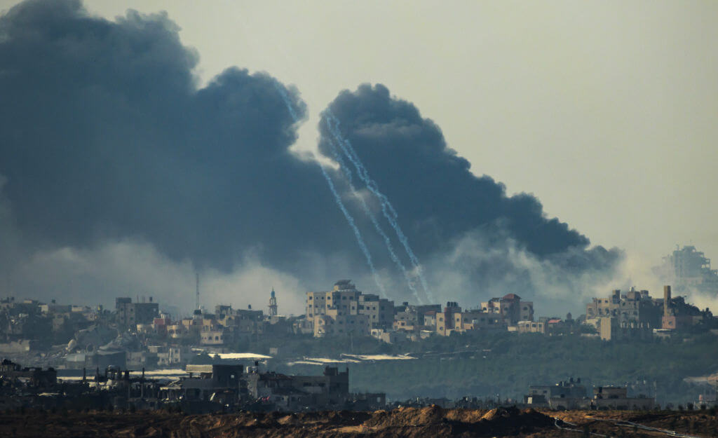 This picture taken from southern Israel near the border with the Gaza Strip shows smoke rising from buildings after being hit by Israeli strikes in the battles between Israel and Hamas militants, on December 1, 2023.
