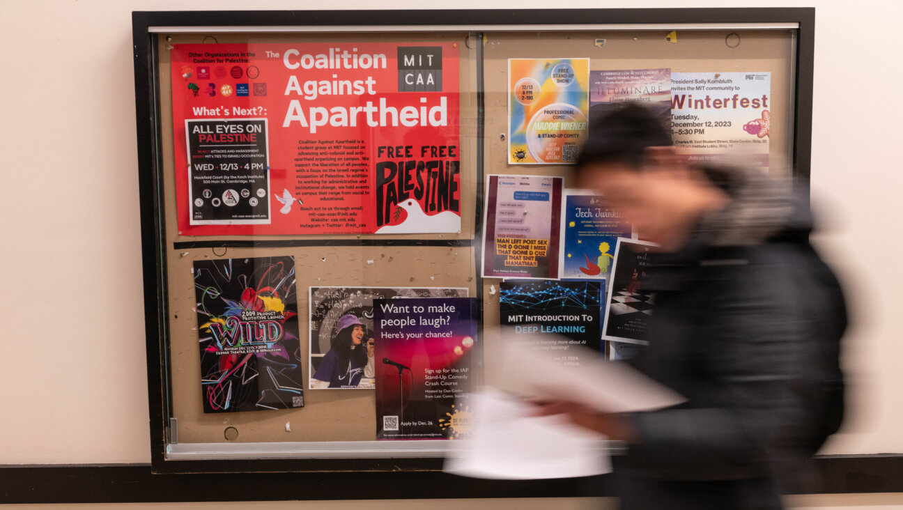 A "Coalition Against Apartheid" poster on the Massachusetts Institute of Technology campus in Cambridge, Mass. on Tuesday, Dec. 12, 2023