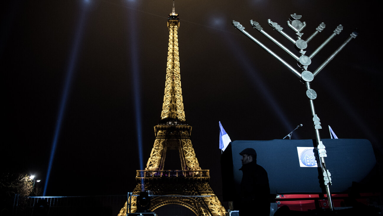 A menorah is lit  near the Eiffel Tower in Paris.