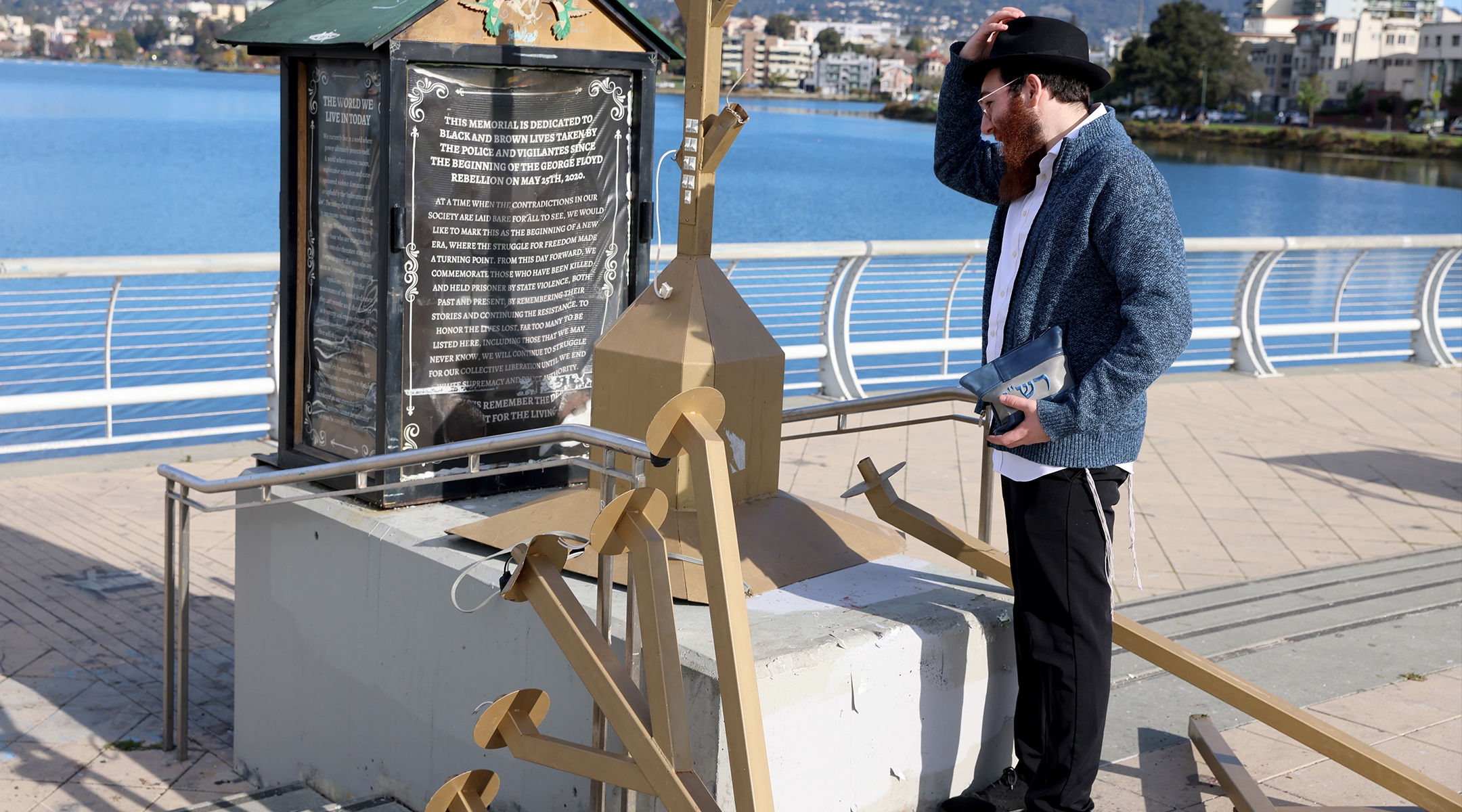 Moshe Turk of the Chabad Jewish Center of Oakland looks at a damaged menorah at the Lake Merritt Amphitheater in Oakland, Calif., Dec. 13, 2023. (Jane Tyska/Digital First Media/East Bay Times via Getty Images)