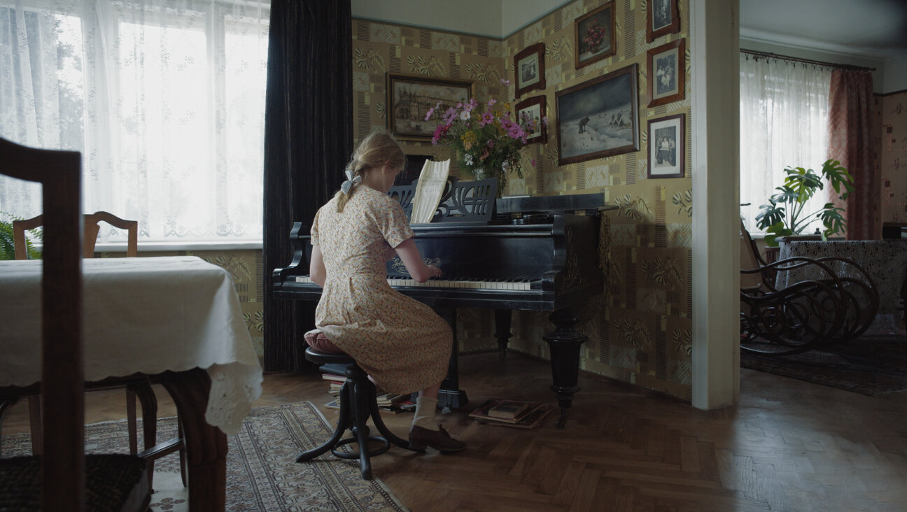 A young girl plays the song "Sunbeams" in Jonathan Glazer's<i>Zone of Interest.</i>
