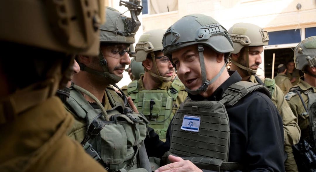 Israeli Prime Minister Benjamin Netanyahu visits IDF soldiers in northern Gaza, Dec. 25, 2023. (GPO/Avi Ohayon)