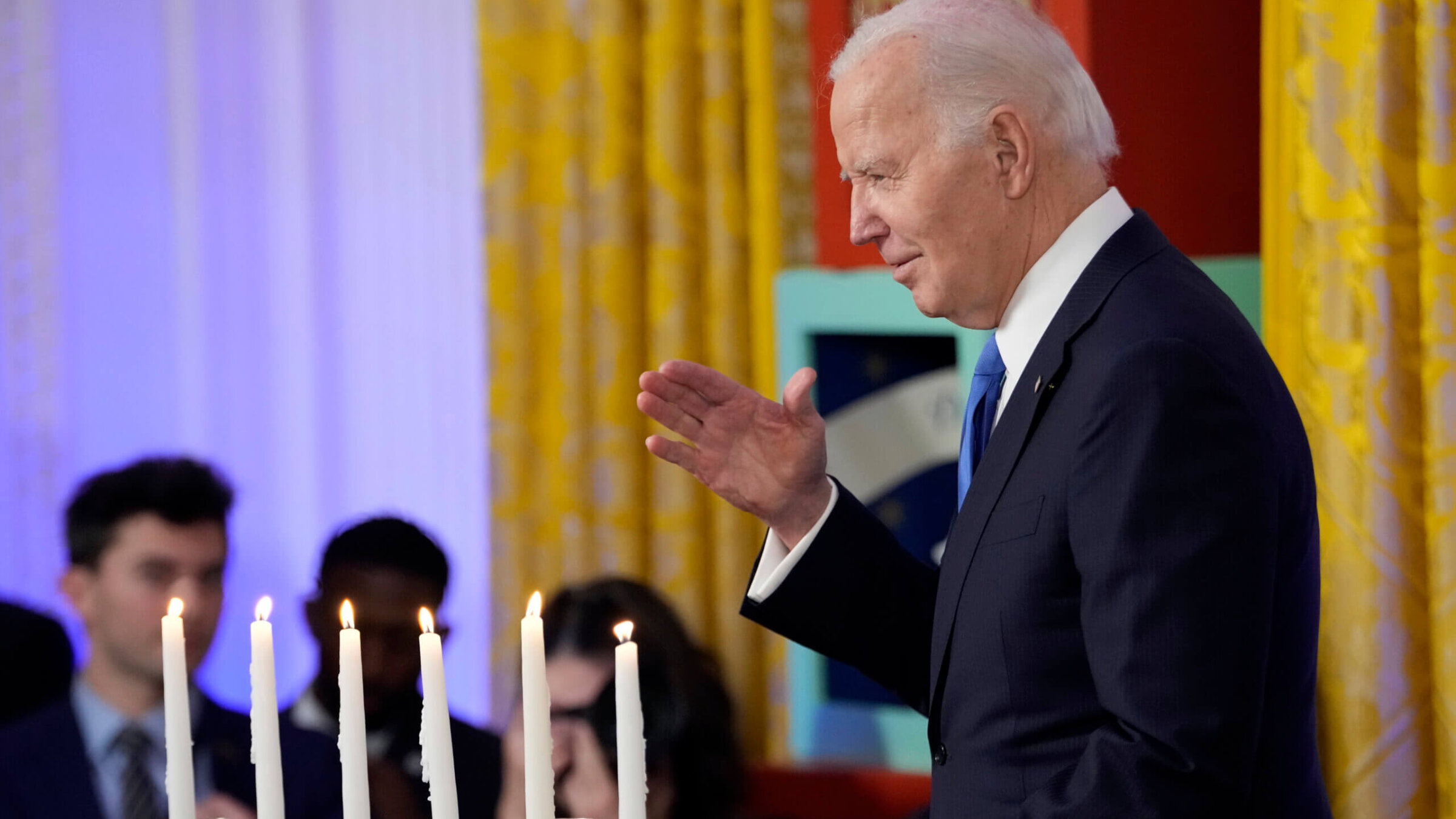 President Joe Biden speaks at a Hanukkah reception in the East Room of the White House on Dec. 11.