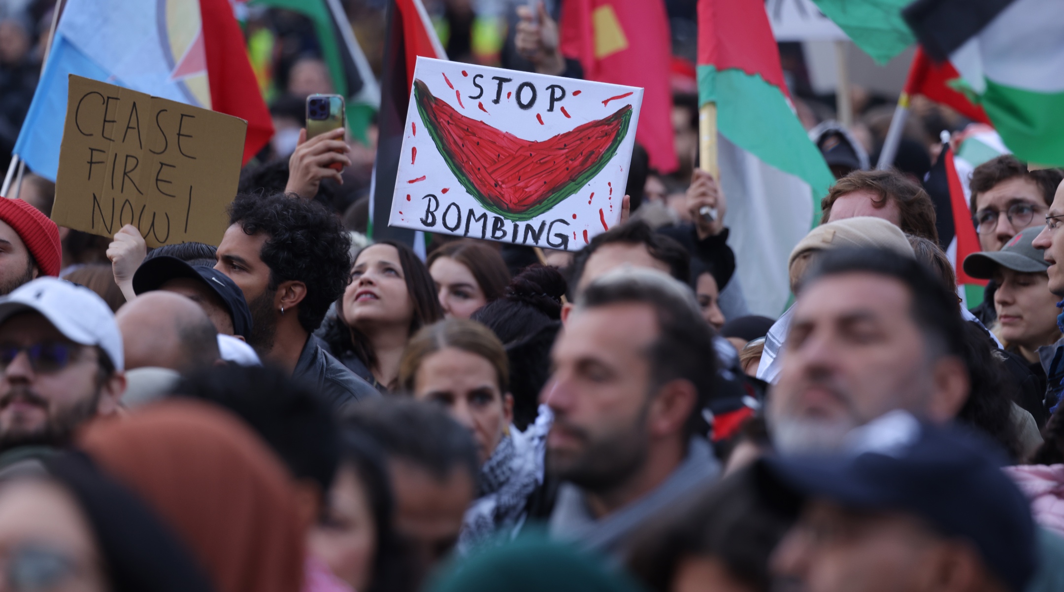 People wave Palestinian flags and hold a picture of a watermelon as they gather for a “Global South United” protest to demand freedom for Palestine in Berlin, Oct. 28, 2023. (Sean Gallup/Getty Images)