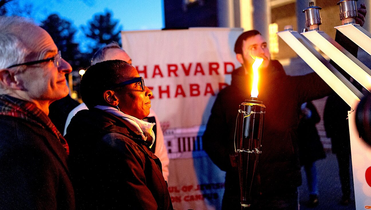 Former Harvard President Claudine Gay attends a menorah lighting ceremony on the seventh night of Hanukkah with the university's Jewish community on Dec. 13, 2023.