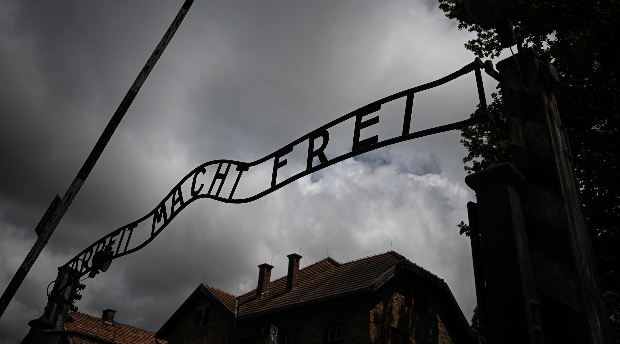 A view of the iconic entrance gate of the Auschwitz concentration camp that reads ‘Arbeit Macht Frei’ (Work Sets You Free) during 83rd anniversary of the first transport of Poles to the Auschwitz camp at Oswiecim, Poland on June 14, 2023. (Omar Marques/Anadolu Agency via Getty Images)