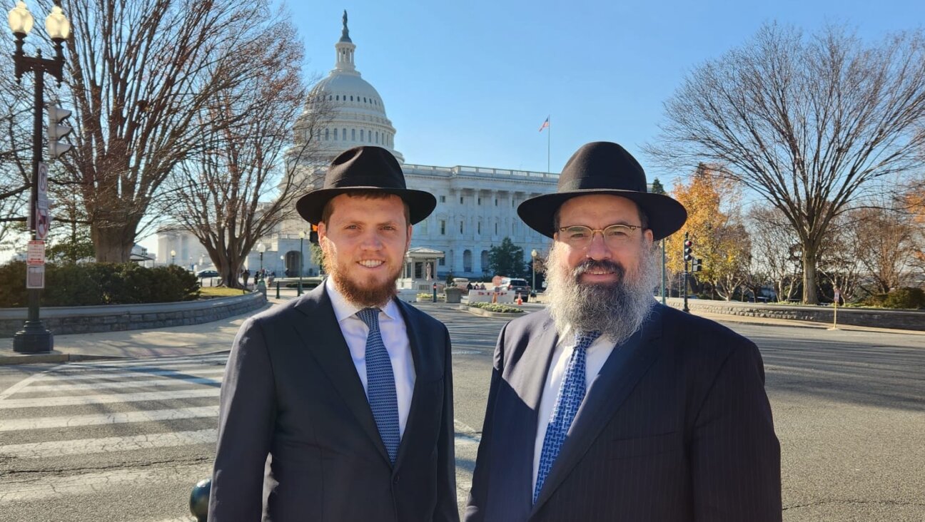 Rabbi Menachem Shemtov, <i>left</i>, poses with his father, Rabbi Levi Shemtov, in this undated photo at the U.S. Capitol.