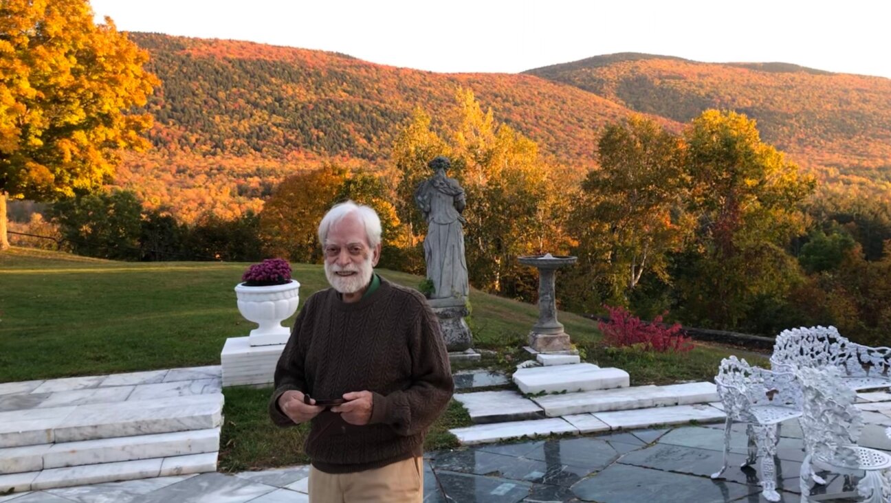 Albert Levis overlooking the deck of his Wilburton Inn, Manchester, Vermont, October 11, 2022. (Andrew Lapin/JTA)