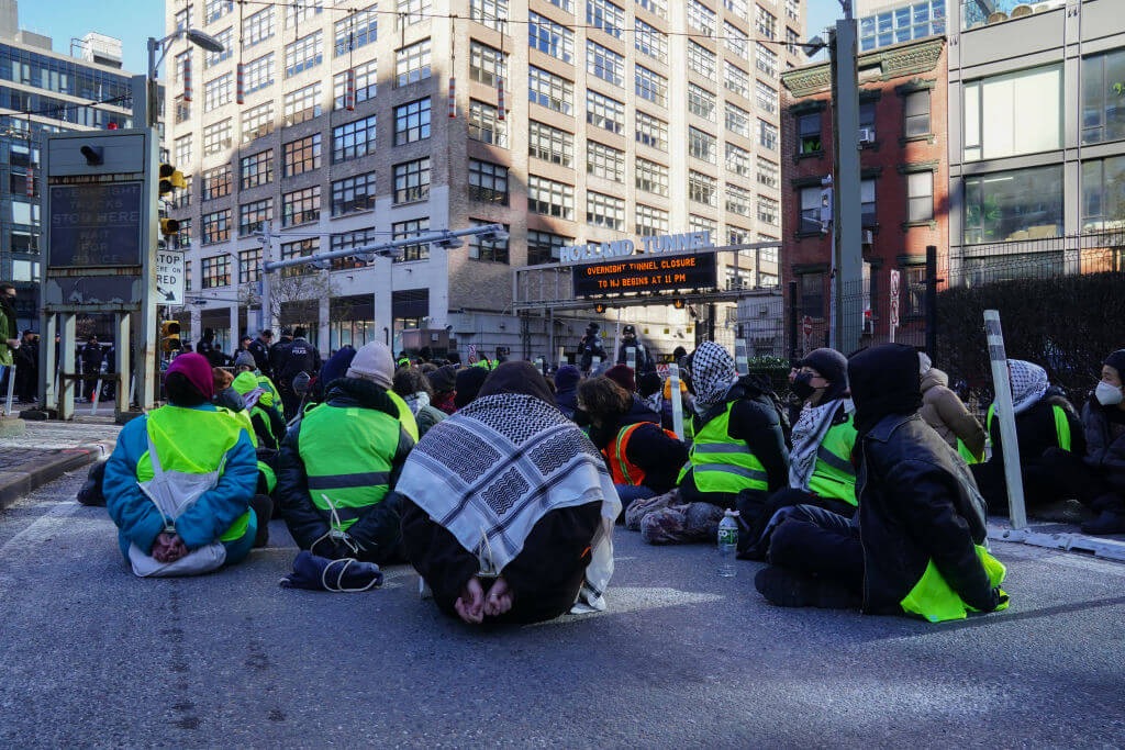 Protesters against the war in Gaza are arrested for blocking traffic at the entrance to the Holland Tunnel on January 8, 2024 in New York. 