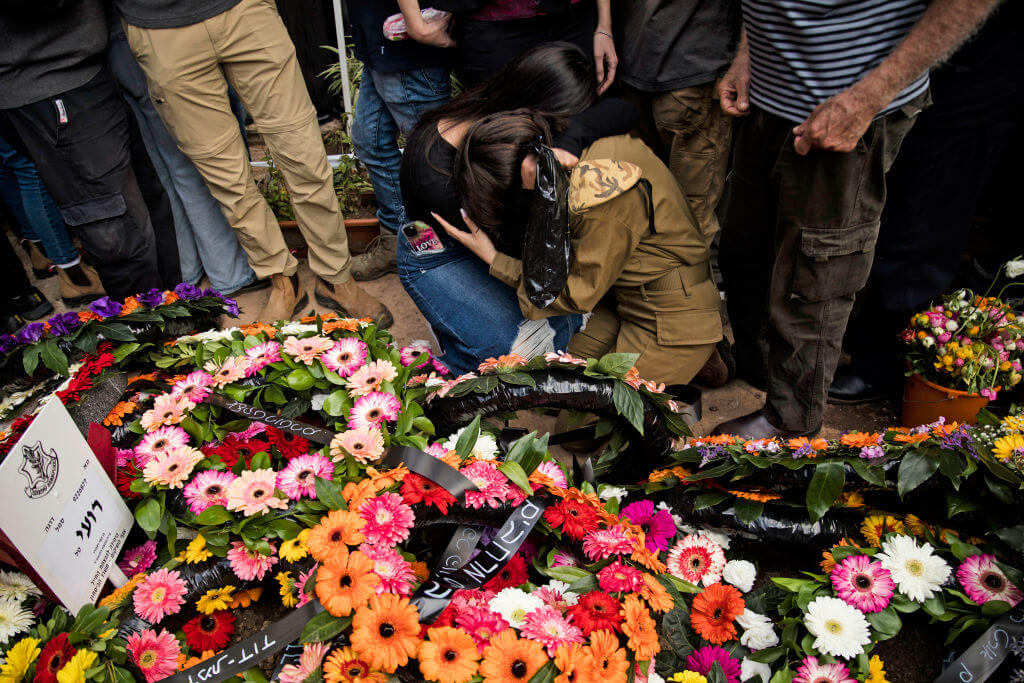 Family and friends mourn during the funeral for IDF soldier Sgt. Roi Tal killed in Southern Gaza on January 9, 2024. 