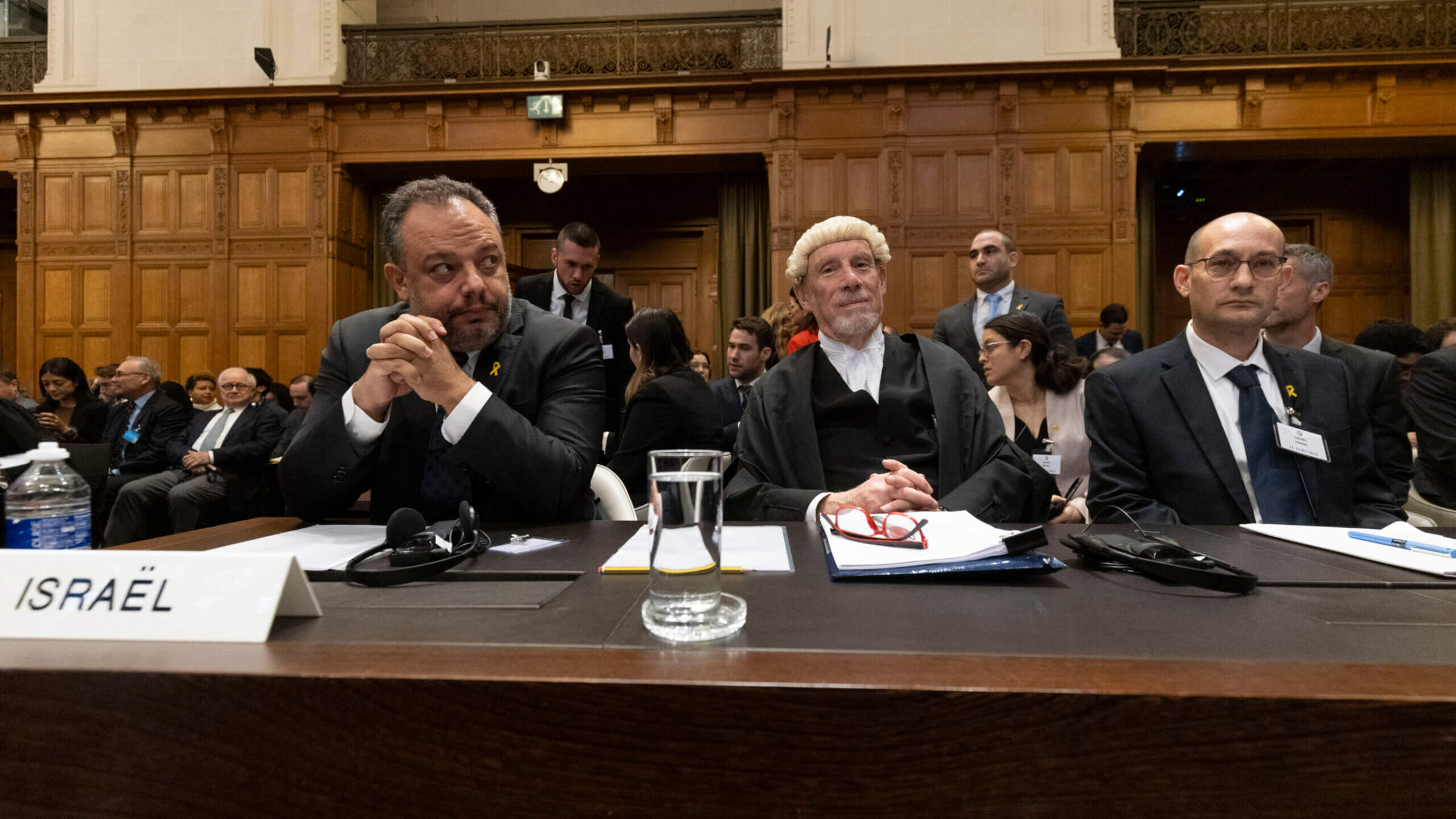 (L-R) Israeli legal counsellor Tal Becker, barrister Malcolm Shaw, and Gilad Noam wait to present Israel's argument before the International Court of Justice, Jan. 12, in The Hague, Netherlands. 