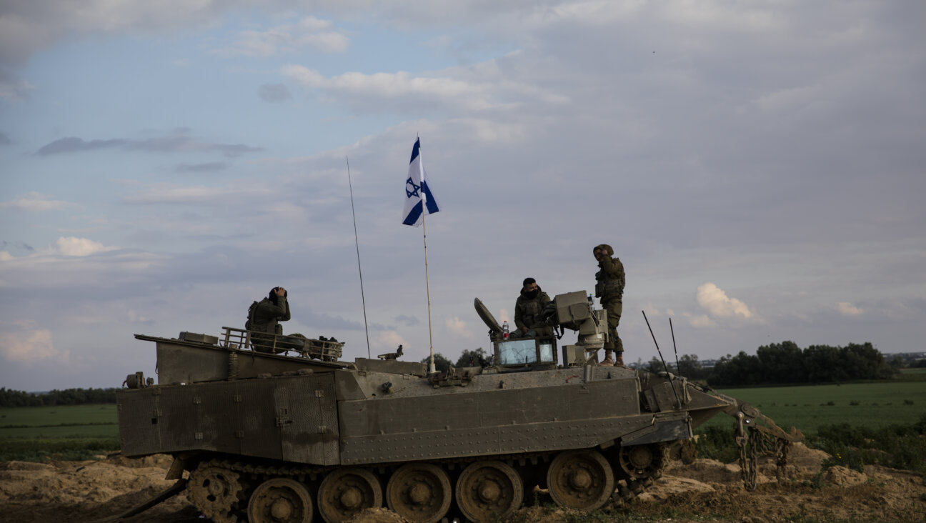 Israeli soldiers sit near the border with Gaza on Jan. 29, 2024 in Israel