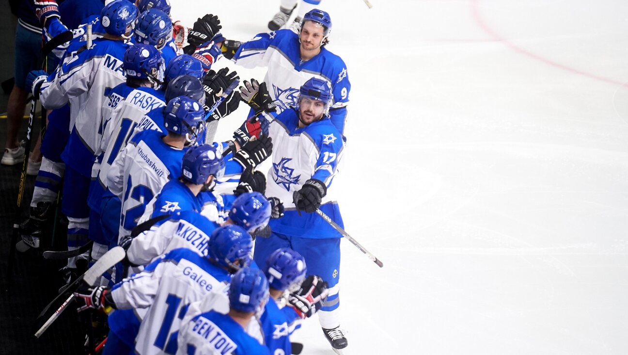 Israeli players celebrating a goal during the IIHF Ice Hockey World Championship match between Israel and Georgia, April 17, 2023, in Madrid. (Borja B. Hojas/Getty Images)