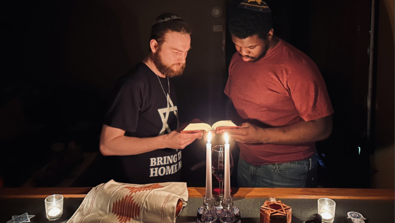 Corey Sheffa, left, and his husband Shavon Sheffa, on a recent Shabbat. The Tennessee couple are in the process of converting to Judaism.