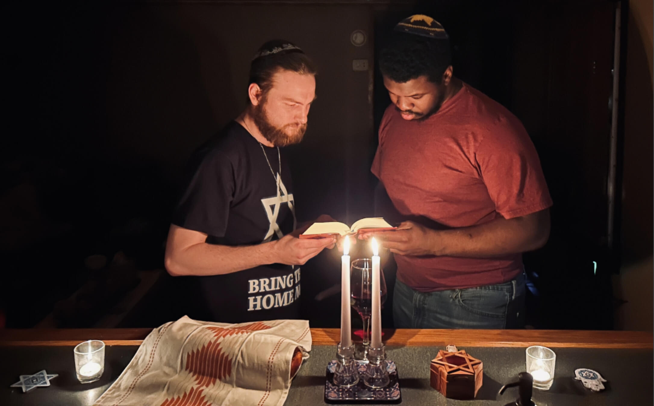 Corey Sheffa, left, and his husband Shavon Sheffa, on a recent Shabbat. The Tennessee couple are in the process of converting to Judaism.
