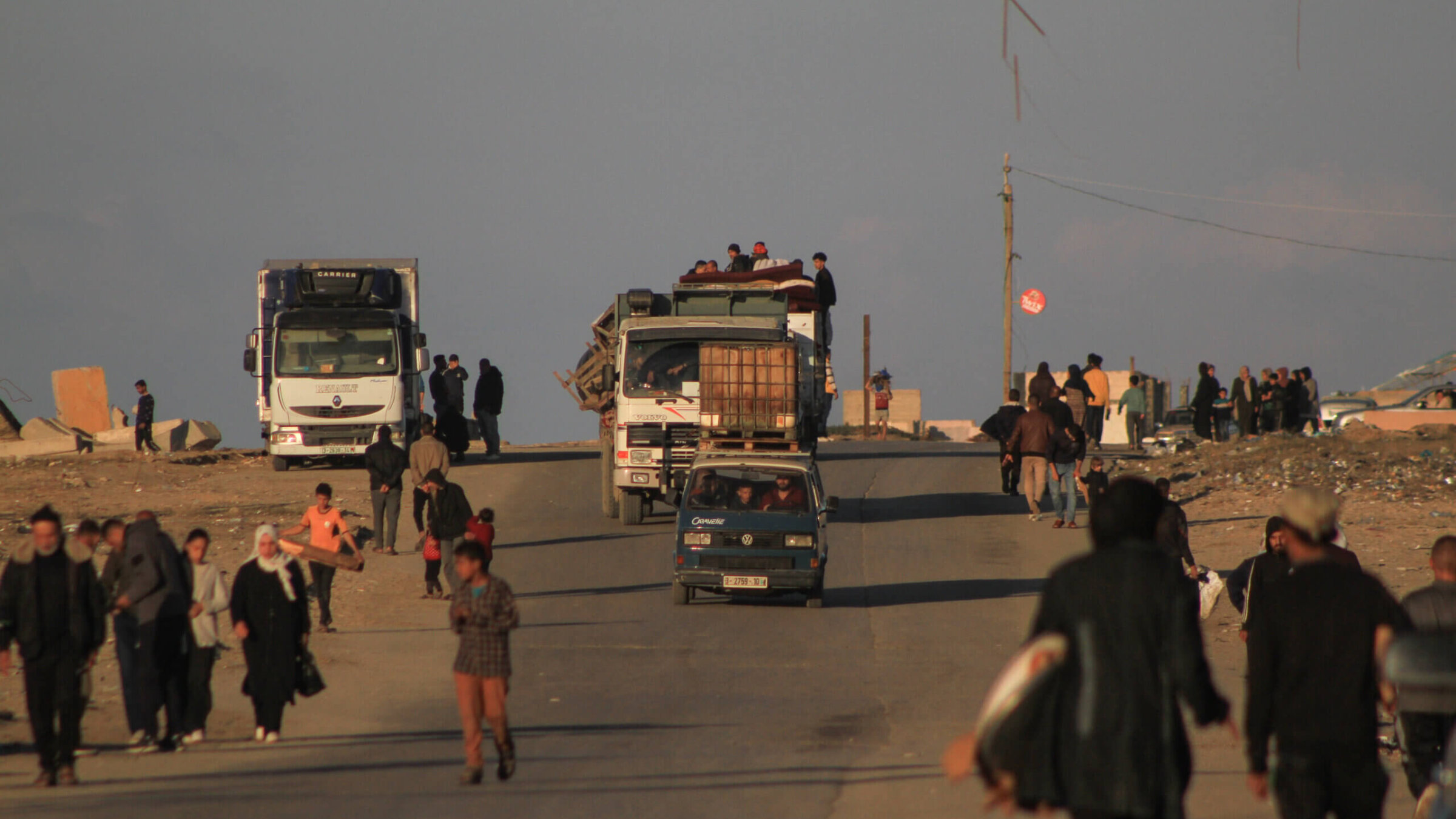 Residents in vehicles head towards southern Gaza, following Israeli evacuation orders, on the coastal sea route in central Gaza, on Thursday, Jan. 4, 2024. 