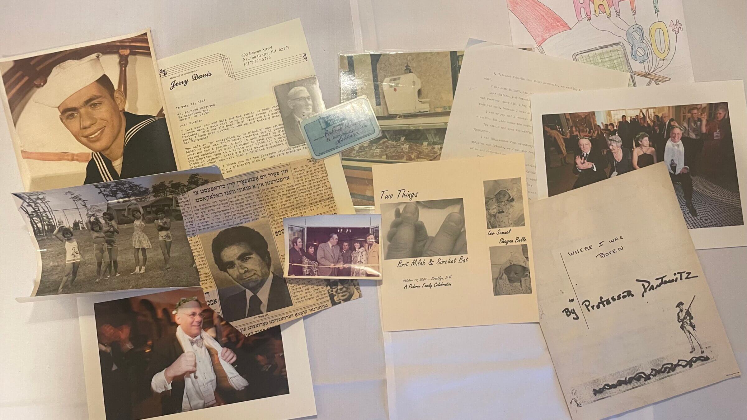 Some of the precious things I saved, including a colorized photo of my dad in the Coast Guard and a black-and-white of my mom as a girl at Camp Wingo (far left); the Jerry Davis Band bill from my 1983 bat mitzvah; a Yiddish newspaper clip about Cantor Paul Zim; photos from the opening of my dad’s butcher shop; the program from my kids’ baby naming; a portrait of my great-grandfather and a copy of his will. 