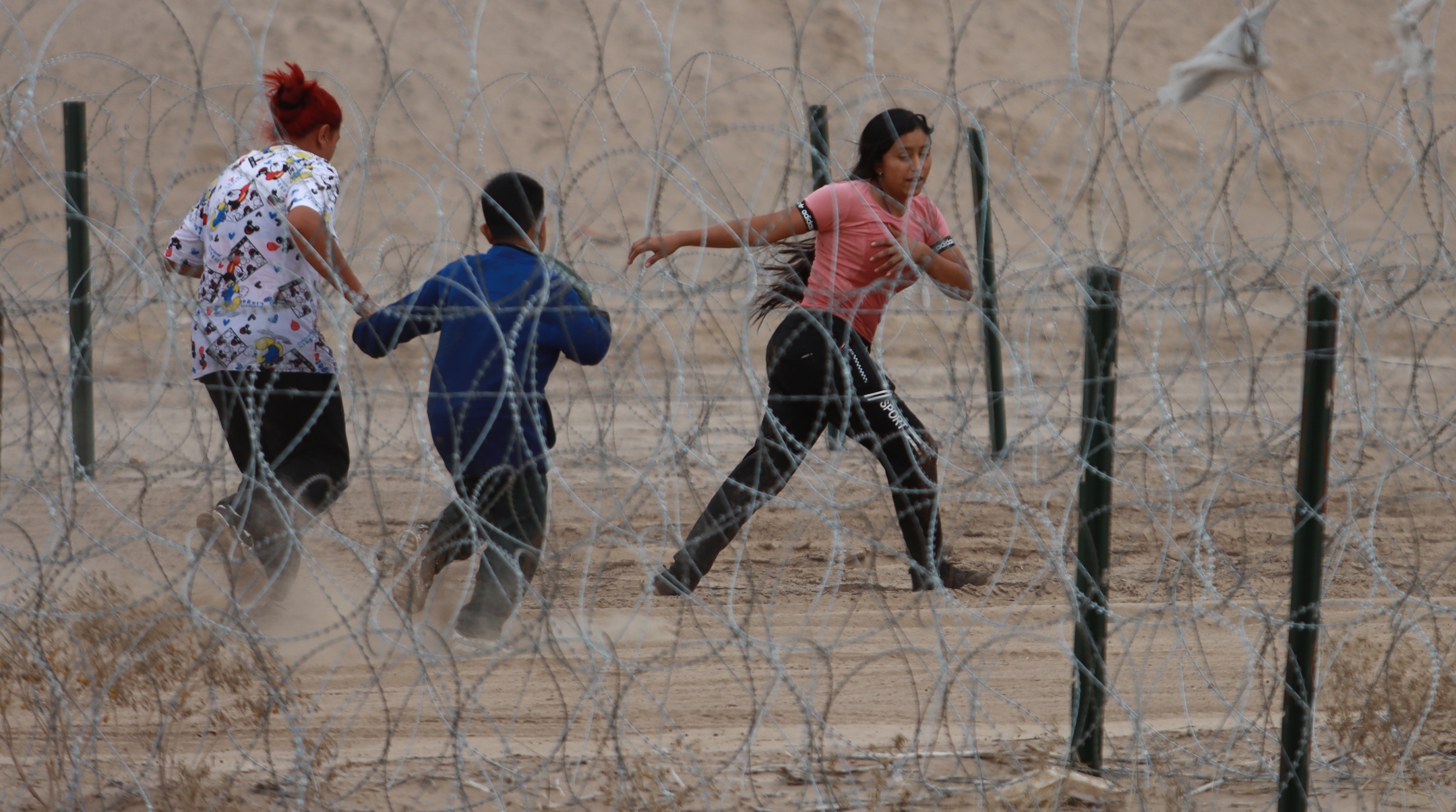 Migrants cross the border to the United States near Ciudad Juarez, Mexico, Feb. 6, 2024. (Christian Torres/Anadolu via Getty Images)