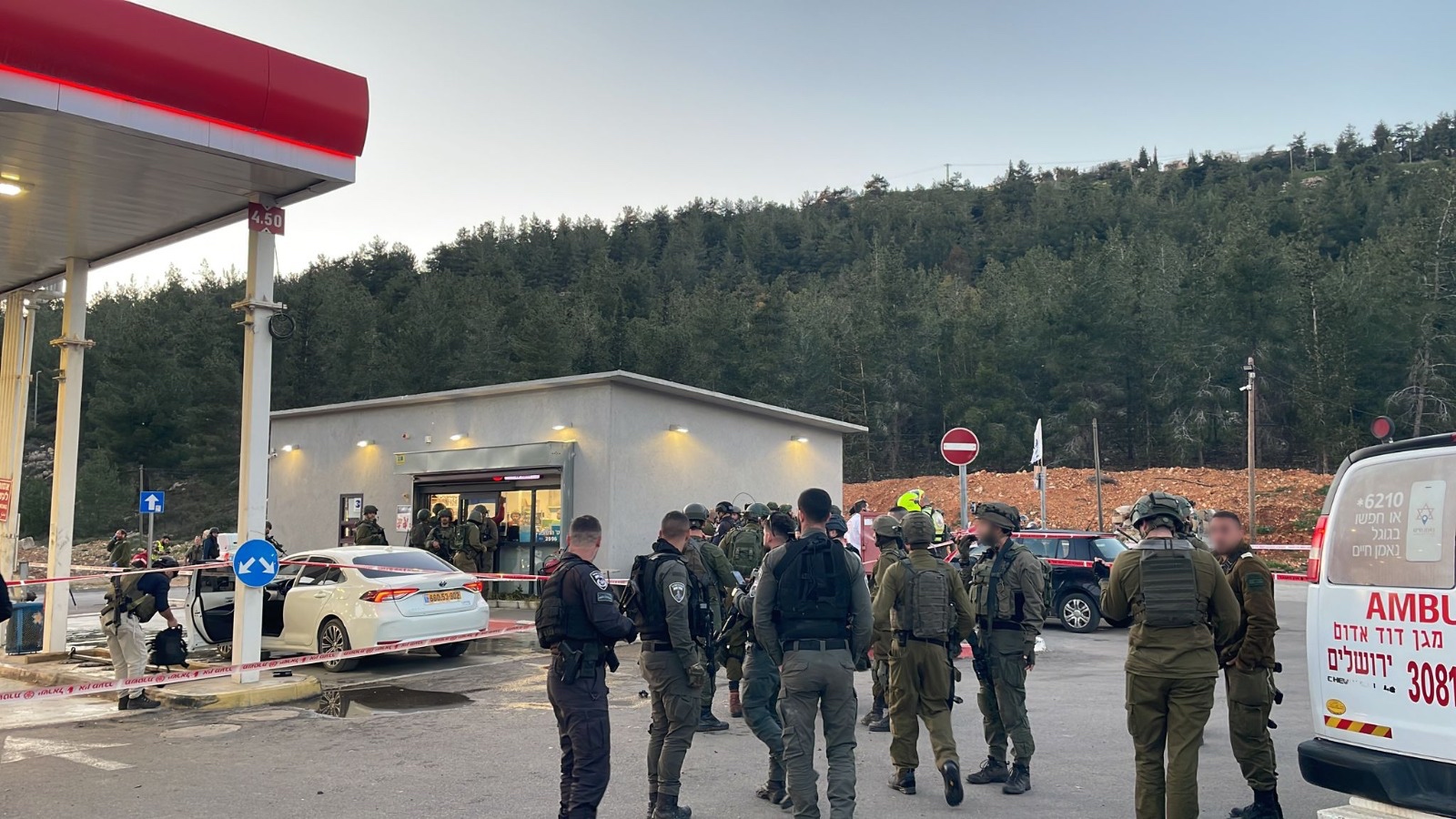 Israeli army troops consult after a terrorist attack at a gas station adjacent to the West Bank settlement of Eli, Feb. 29, 2024. (IDF)