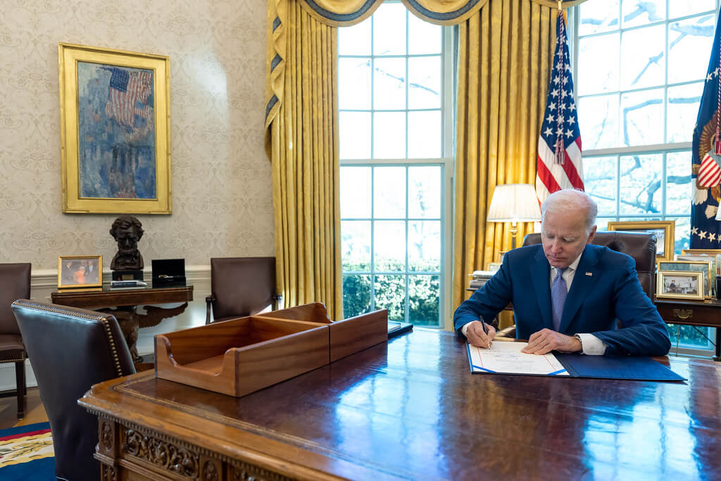 President Joe Biden signing an executive order on April 10, 2023.