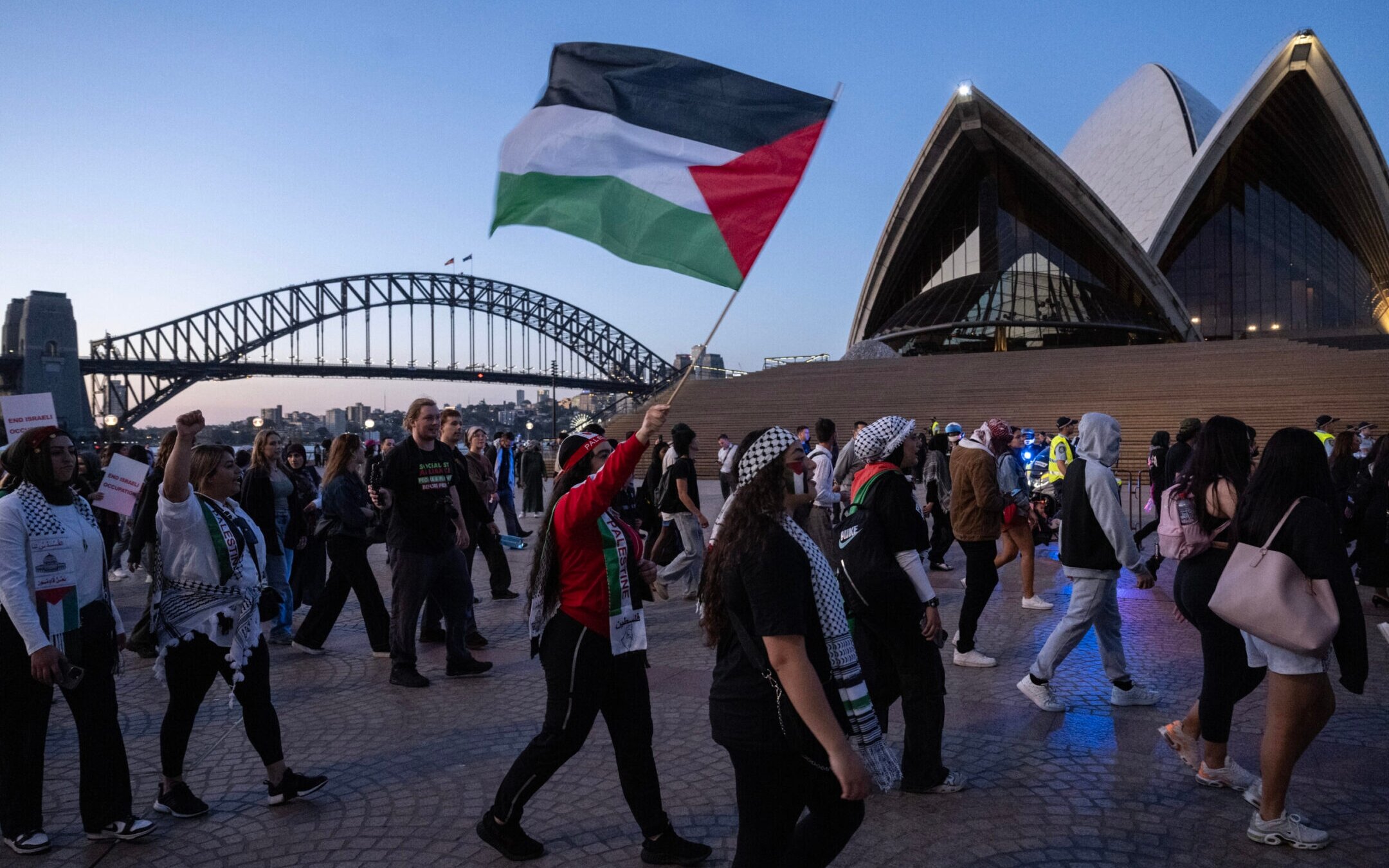 Pro-Palestinian protesters rally in front of the Opera House in Sydney, Oct. 9, 2023. (Louie Douvis / The Sydney Morning Herald via Getty Images)