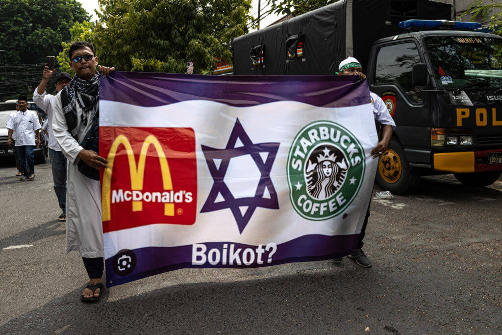 Protesters demand boycotts of McDonald's, Starbucks and other Western brands in Surabaya, Indonesia, Oct. 17.