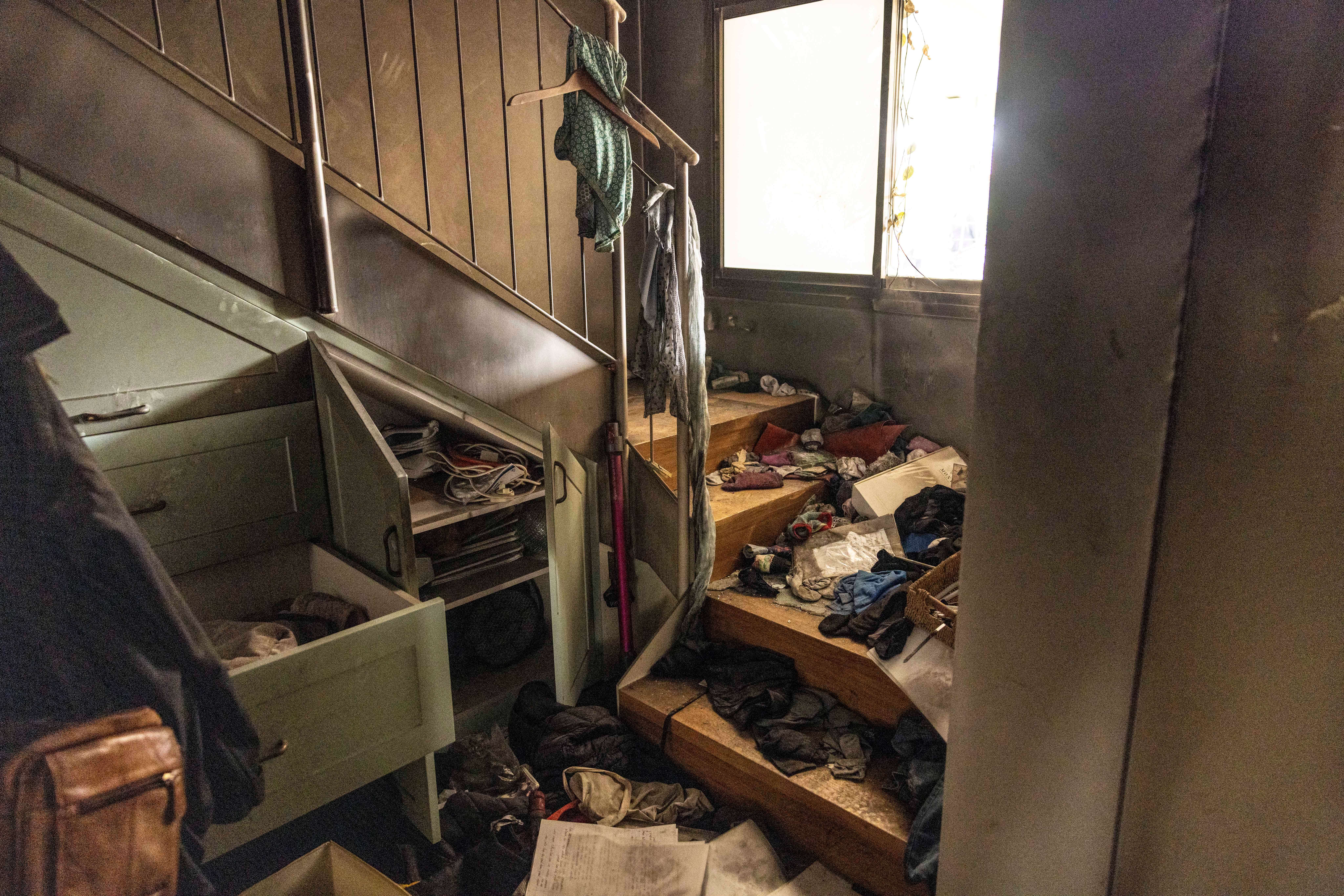 Damage is seen inside a house at Kibbutz Be'eri.