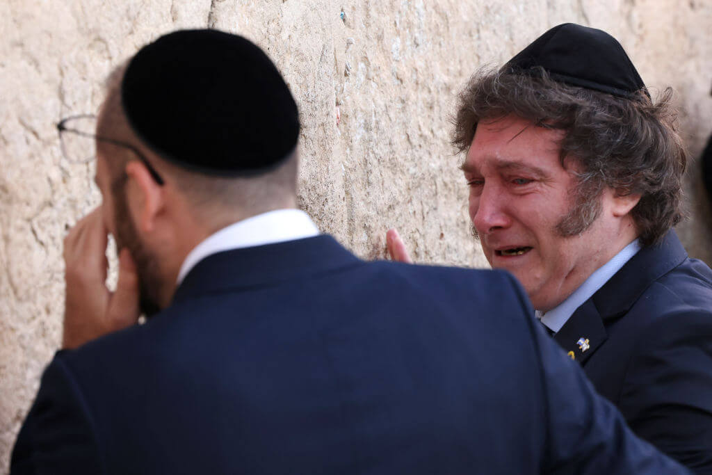 Argentina's President Javier Milei, right, cries with Rabbi Shimon Axel Wahnish during a visit to the Western Wall on February 6, 2024.