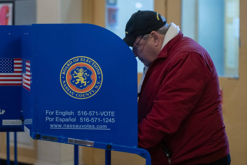 A voter casts a ballot on Feb. 13, 2024.  