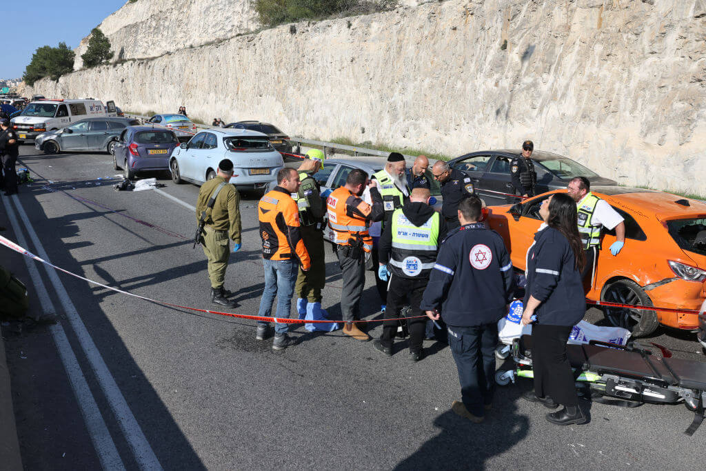 Israeli security forces gather at the scene of a shooting attack on February 22, 2024, next to Maale Adumim settlement, east of Jerusalem.