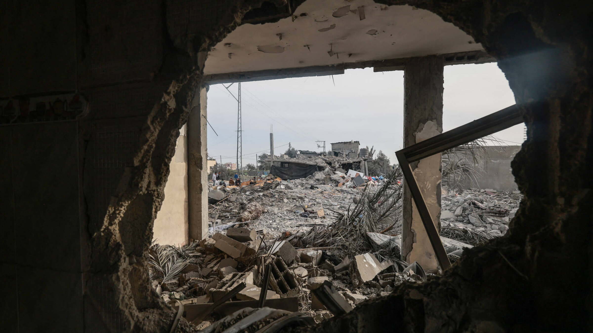 People check the destruction caused by overnight Israeli bombardment in Rafah on Feb. 23.
