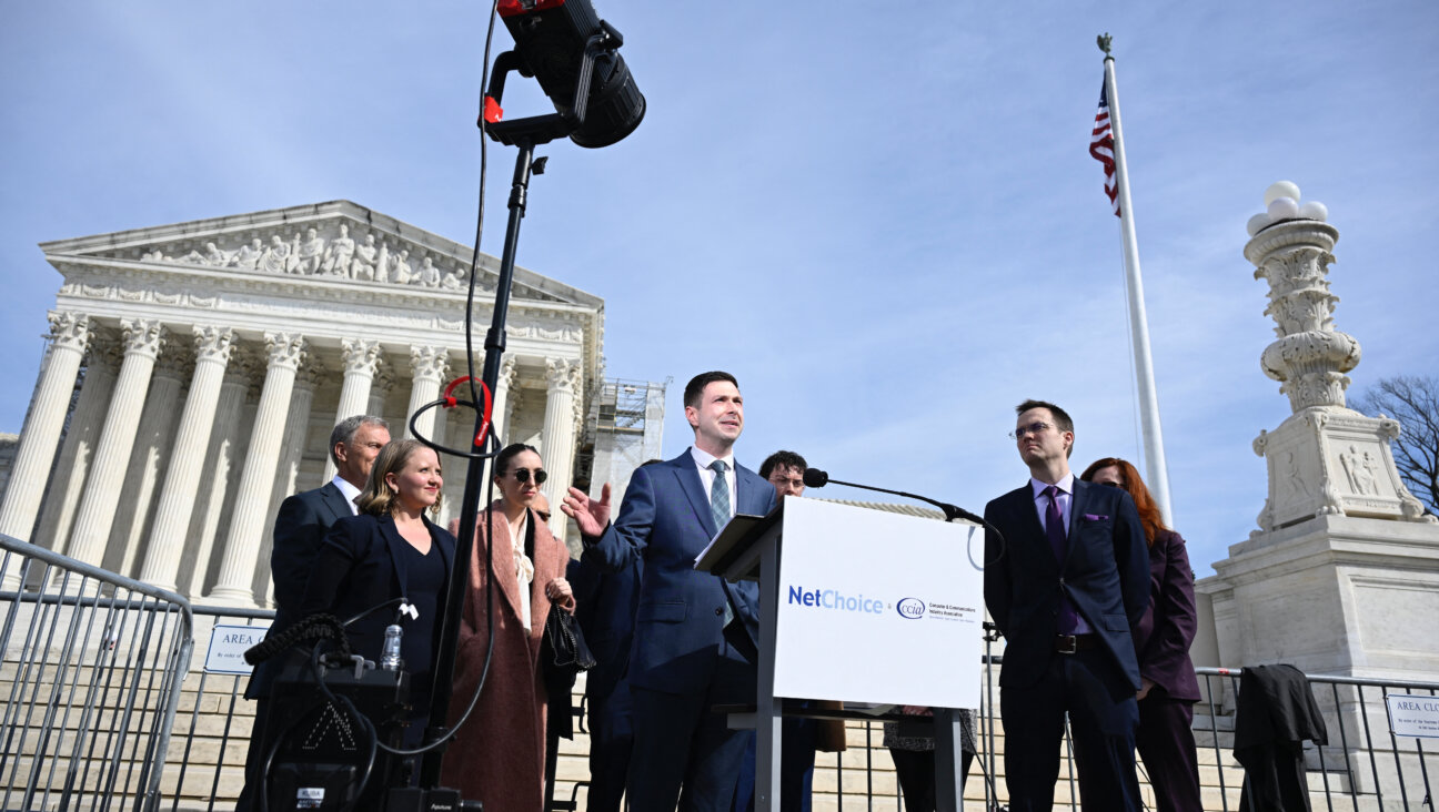 The director of NetChoice speaks outside the U.S. Supreme Court after the court heard the case on social media moderation.